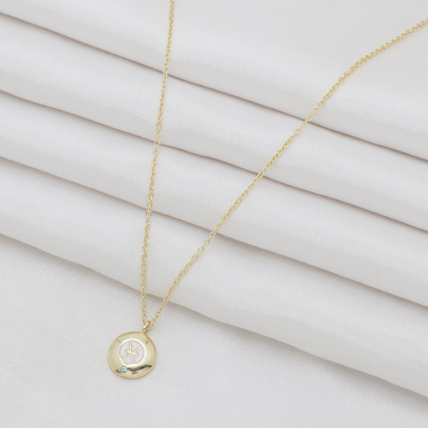 Pisces Zodiac Sign chain necklace with white enamel and Blue Topaz birthstone in 22k gold plated 925 sterling silver
