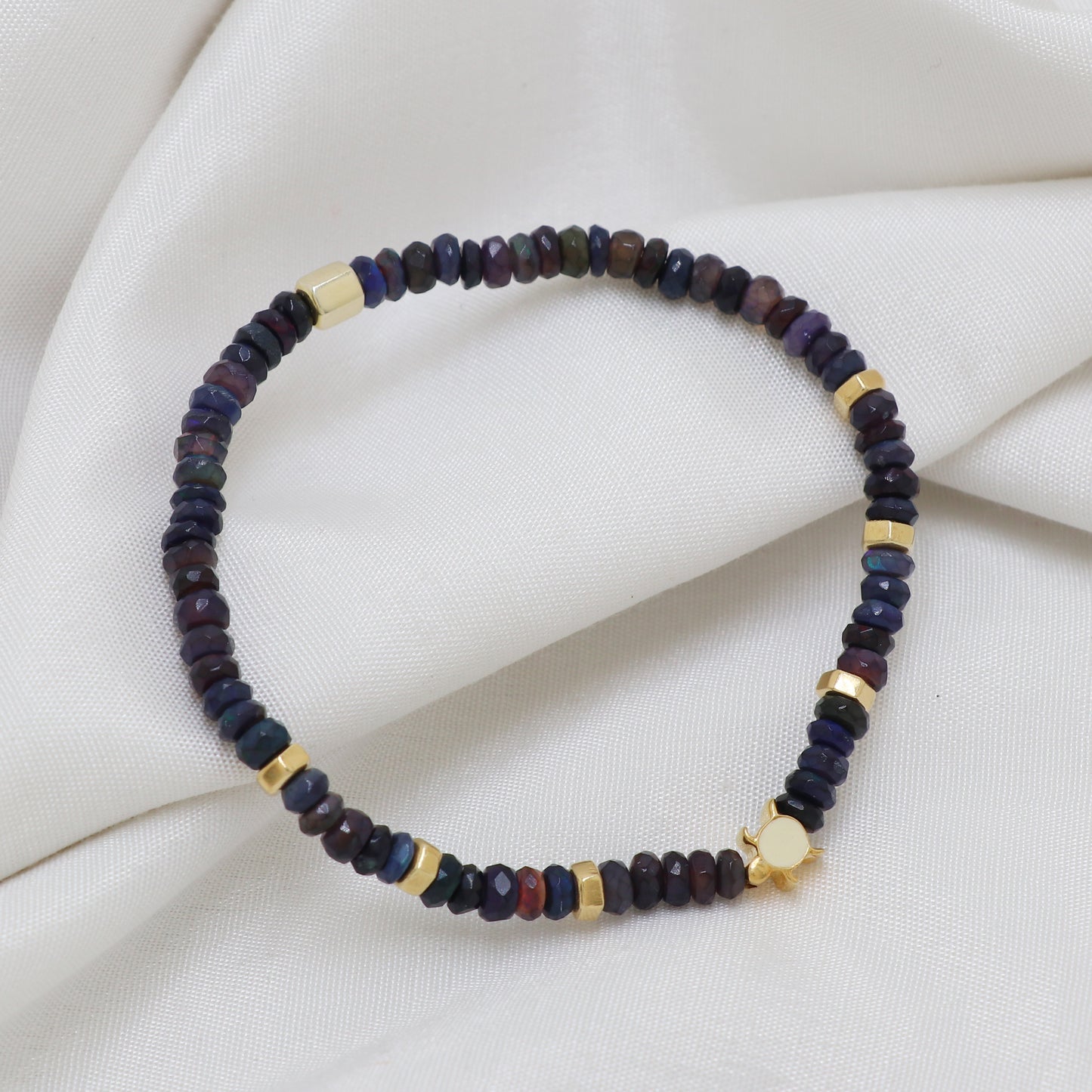 Blue Opal Turtle charm stretch bracelet with  white enamel in gold plated 925 sterling silver.