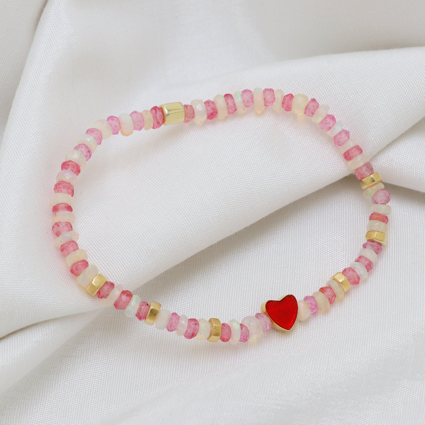 Pink Quartz And White Opal Heart charm stretch bracelet with red enamel in gold plated 925 sterling silver.