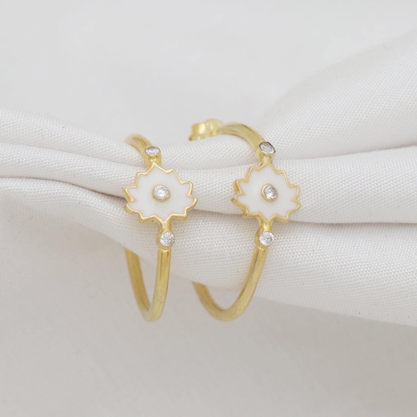 White enamel lotus hoop earrings in gold plated 925 sterling silver