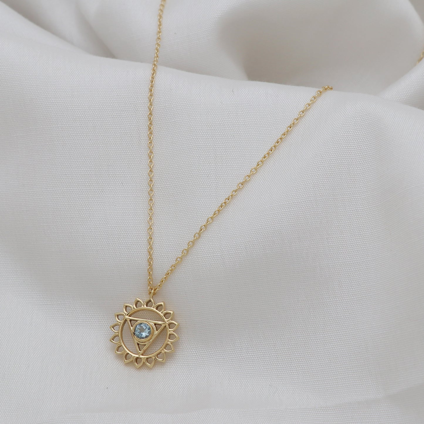 Vishuddha Throat Chakra Charm necklace with Blue Topaz gemstone in 22k gold plated 925 sterling silver