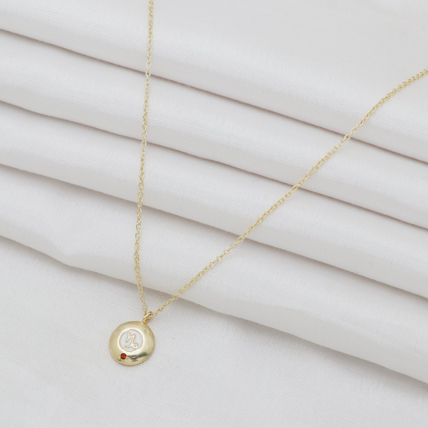 Capricorn Zodiac Sign chain necklace with white enamel and Garnet birthstone in 22k gold plated 925 sterling silver