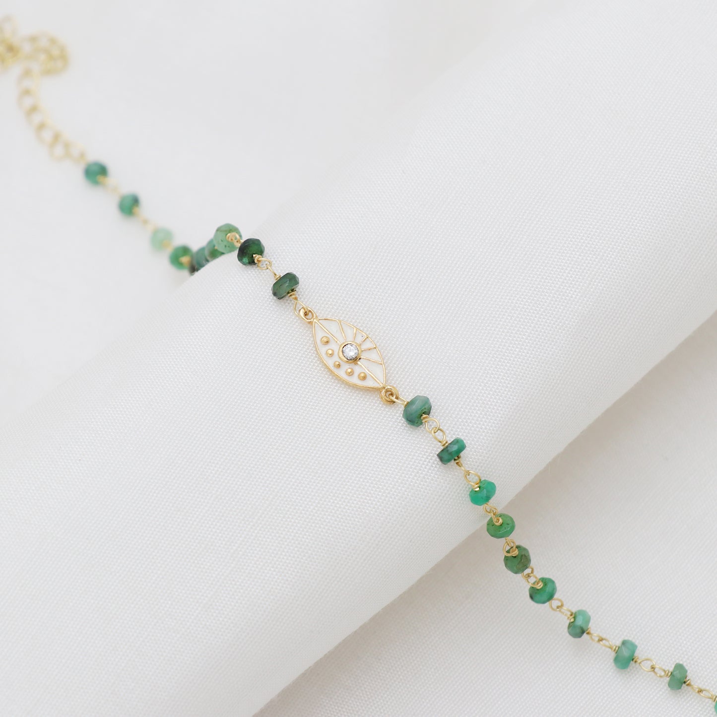 Emerald evil eye charm rosary bracelet with white enamel and zircon stone in gold plated 925 sterling silver