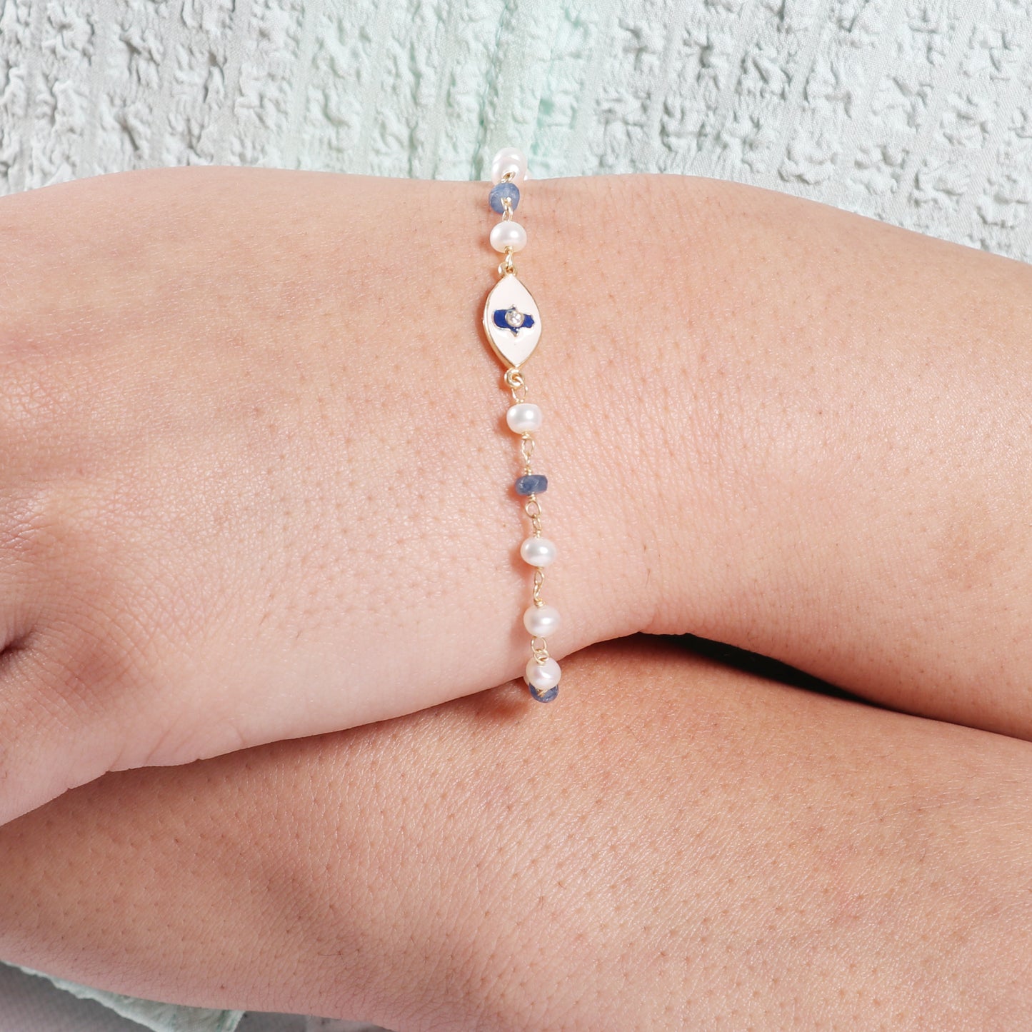 Blue Sapphire and pearl hamsa charm rosary bracelet with blue and white enamel and zircon stone in gold plated 925 sterling silver