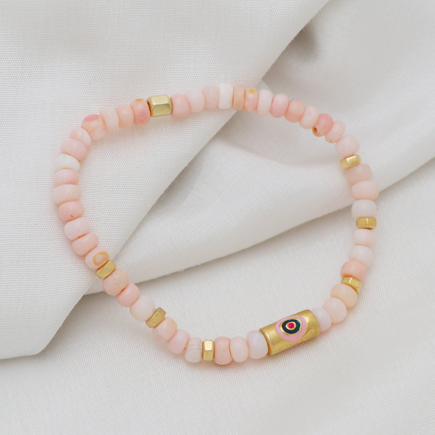 Pink opal evil eye charm stretch bracelet with pink and blue enamel in gold plated 925 sterling silver