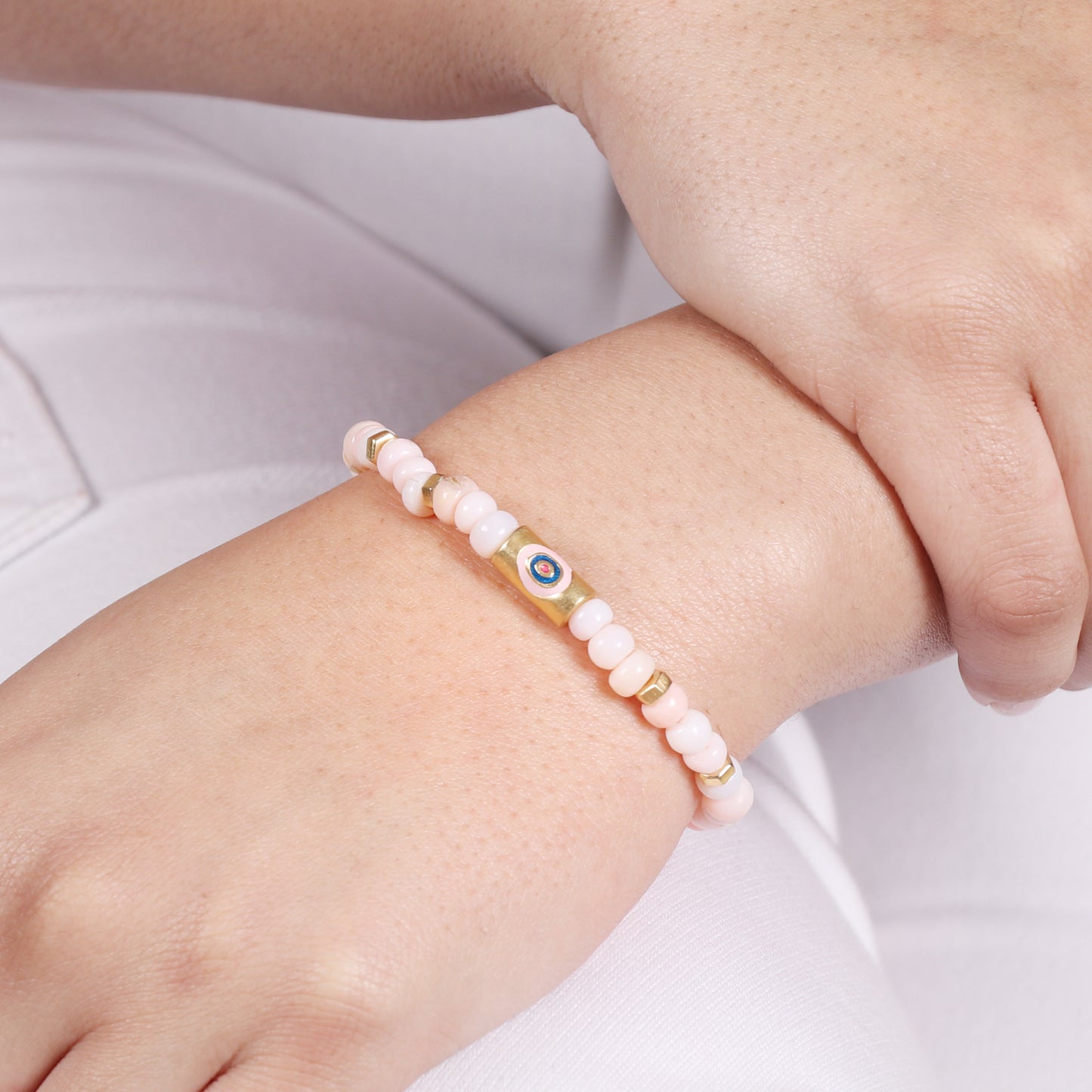 Pink opal evil eye charm stretch bracelet with pink and blue enamel in gold plated 925 sterling silver