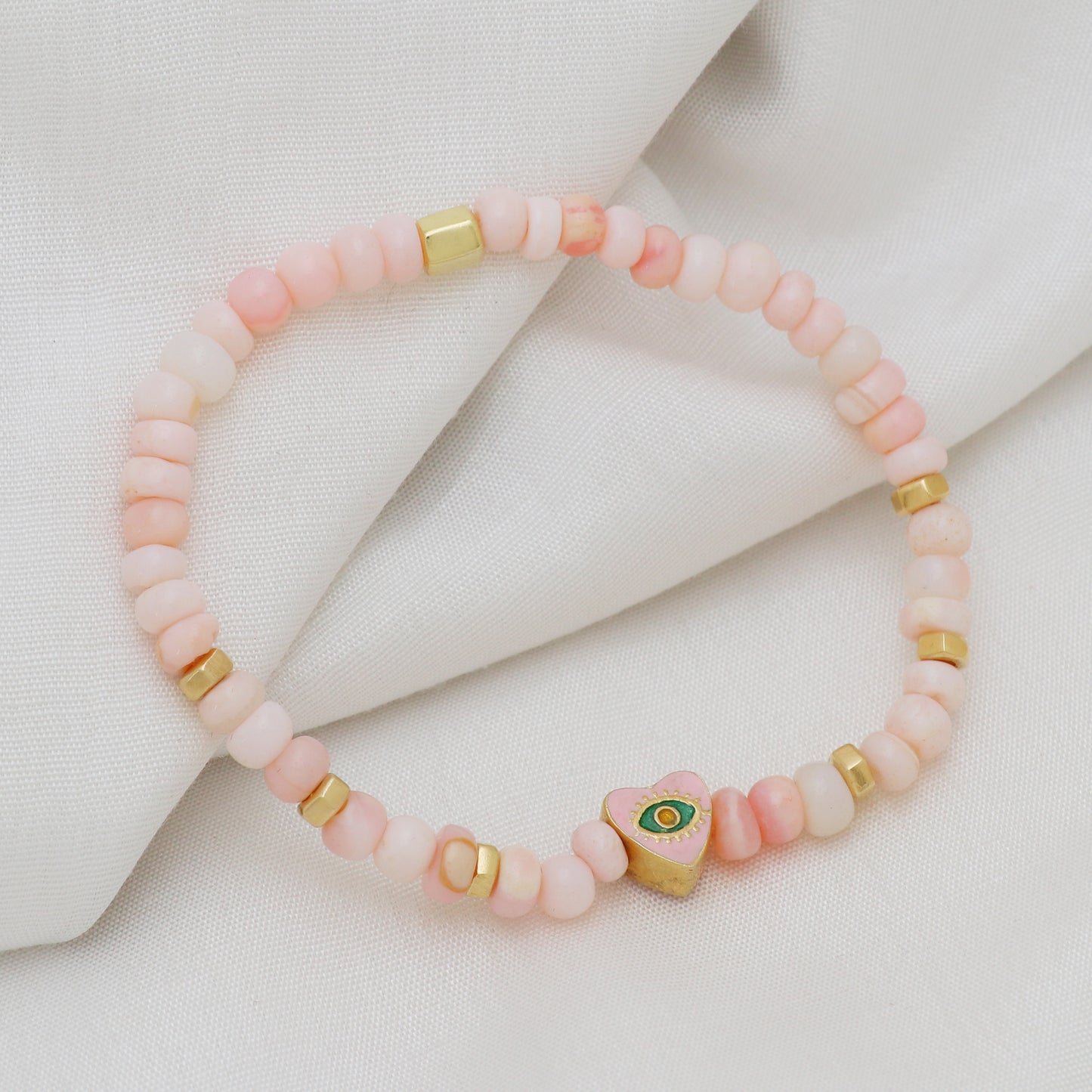Pink opal heart evil eye charm stretch bracelet with pink, green and yellow enamel