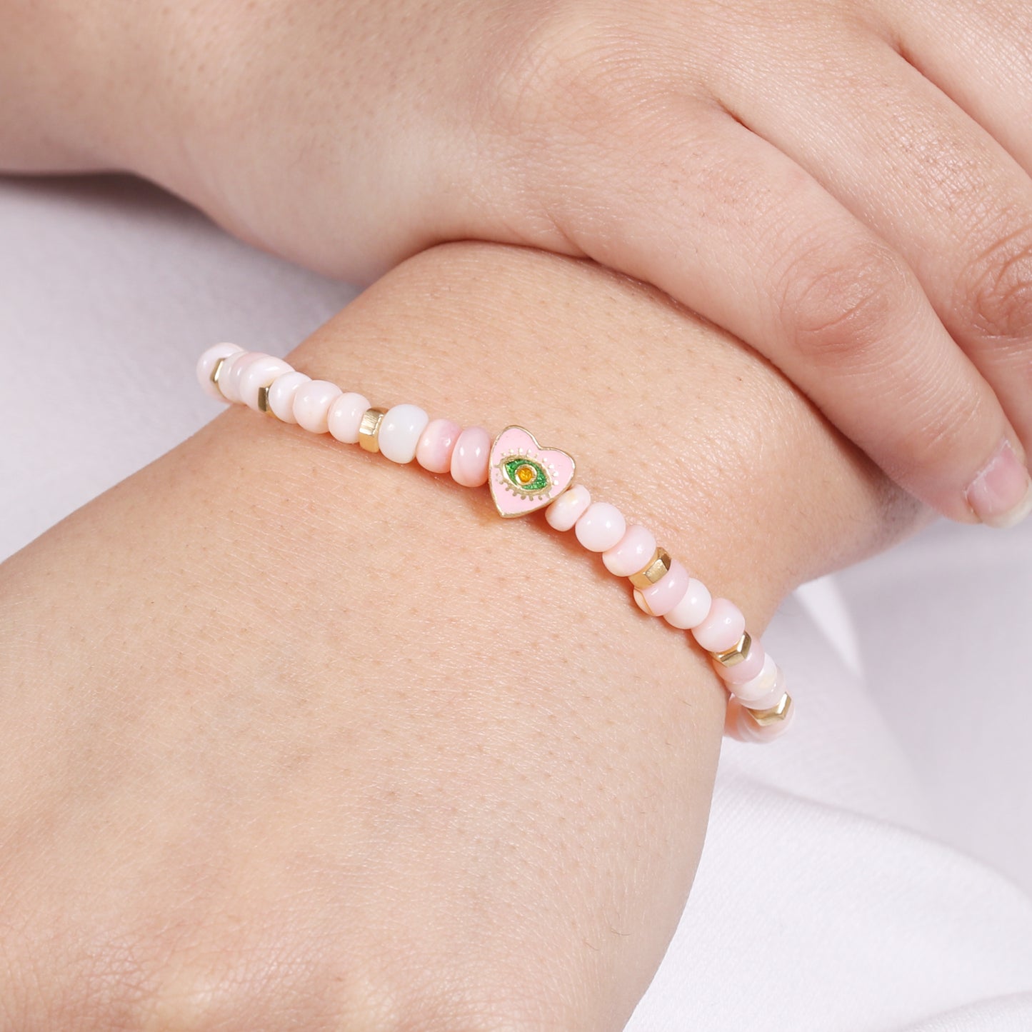 Pink opal heart evil eye charm stretch bracelet with pink, green and yellow enamel