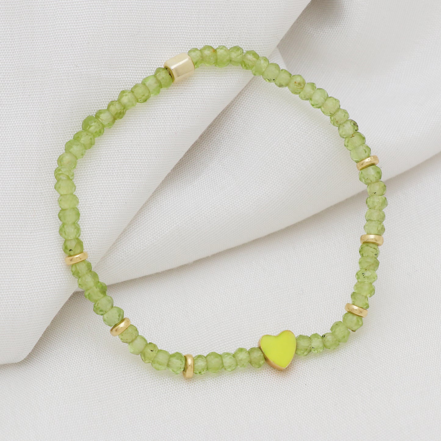 Peridot heart charm stretch bracelet with green enamel in gold plated 925 sterling silver