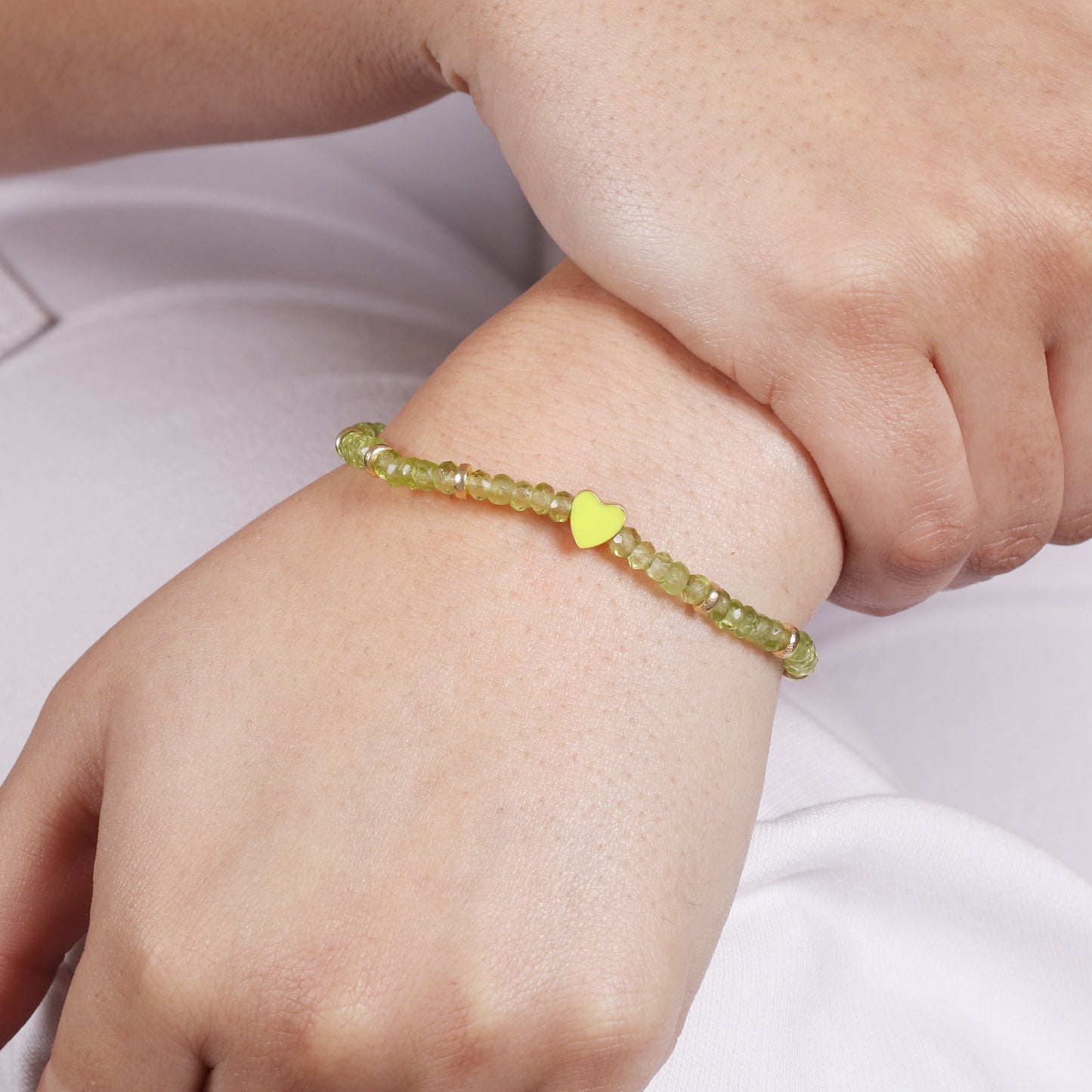 Peridot heart charm stretch bracelet with green enamel in gold plated 925 sterling silver