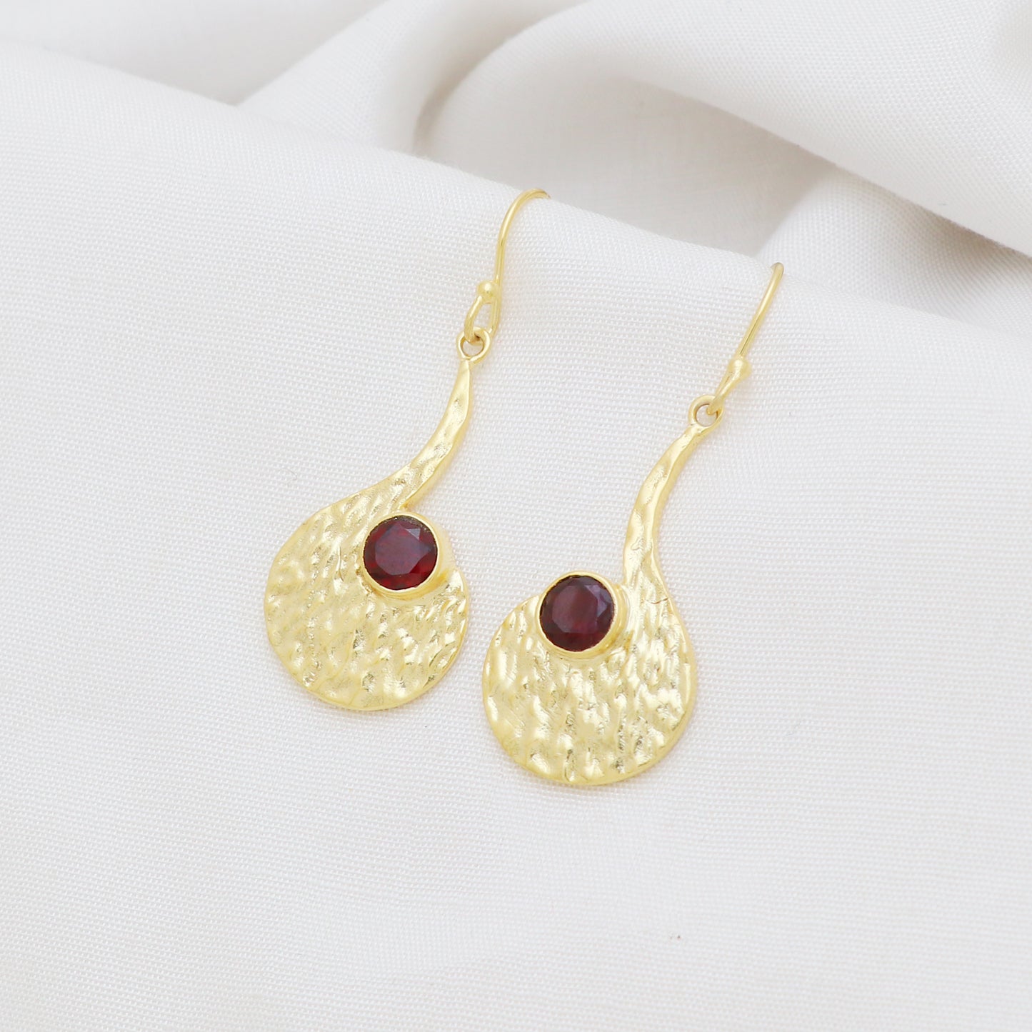 Gold plated 925 sterling silver textured earrings with garnet gemstone