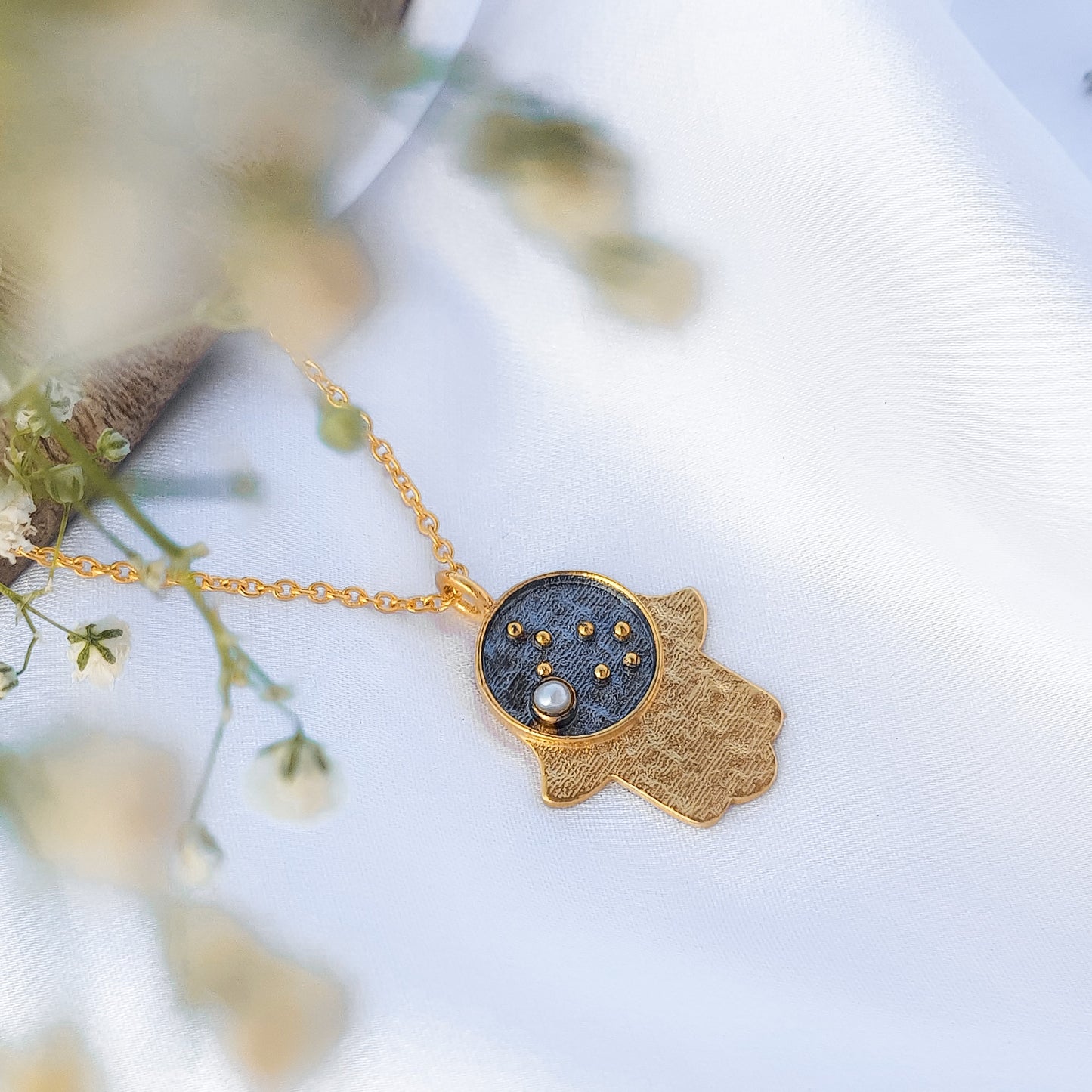 Gemini Zodiac Constellation chain necklace with Hamsa Charm and Pearl birthstone in two tone black rhodium and 22k gold plated 925 sterling silver