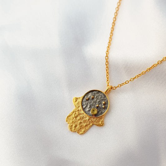 Leo Zodiac Constellation chain necklace with Hamsa Charm and Peridot birthstone in two tone black rhodium and 22k gold plated 925 sterling silver