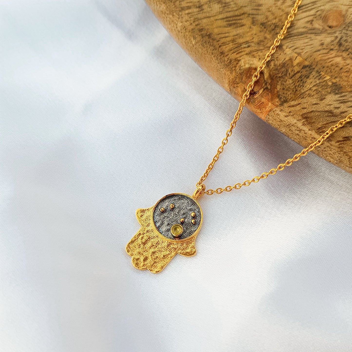 Leo Zodiac Constellation chain necklace with Hamsa Charm and Peridot birthstone in two tone black rhodium and 22k gold plated 925 sterling silver
