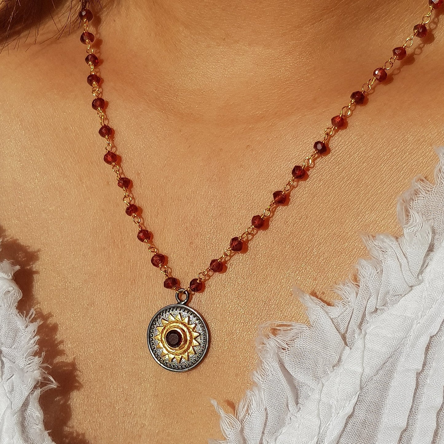Garnet beaded necklace with Sun charm in two tone black rhodium and 22k gold plated 925 sterling silver