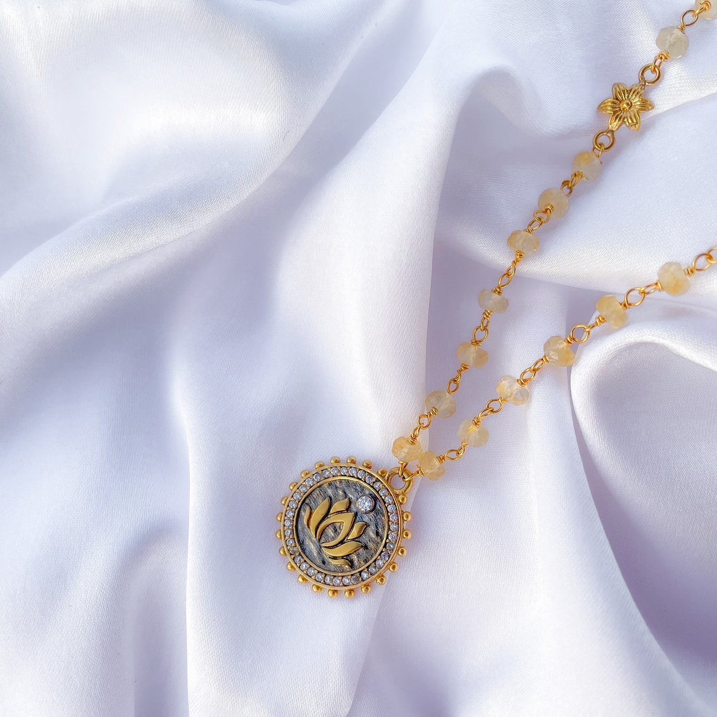 Citrine beaded necklace with Lotus charm and zircon stones in two tone black rhodium and 22k gold plated 925 sterling silver