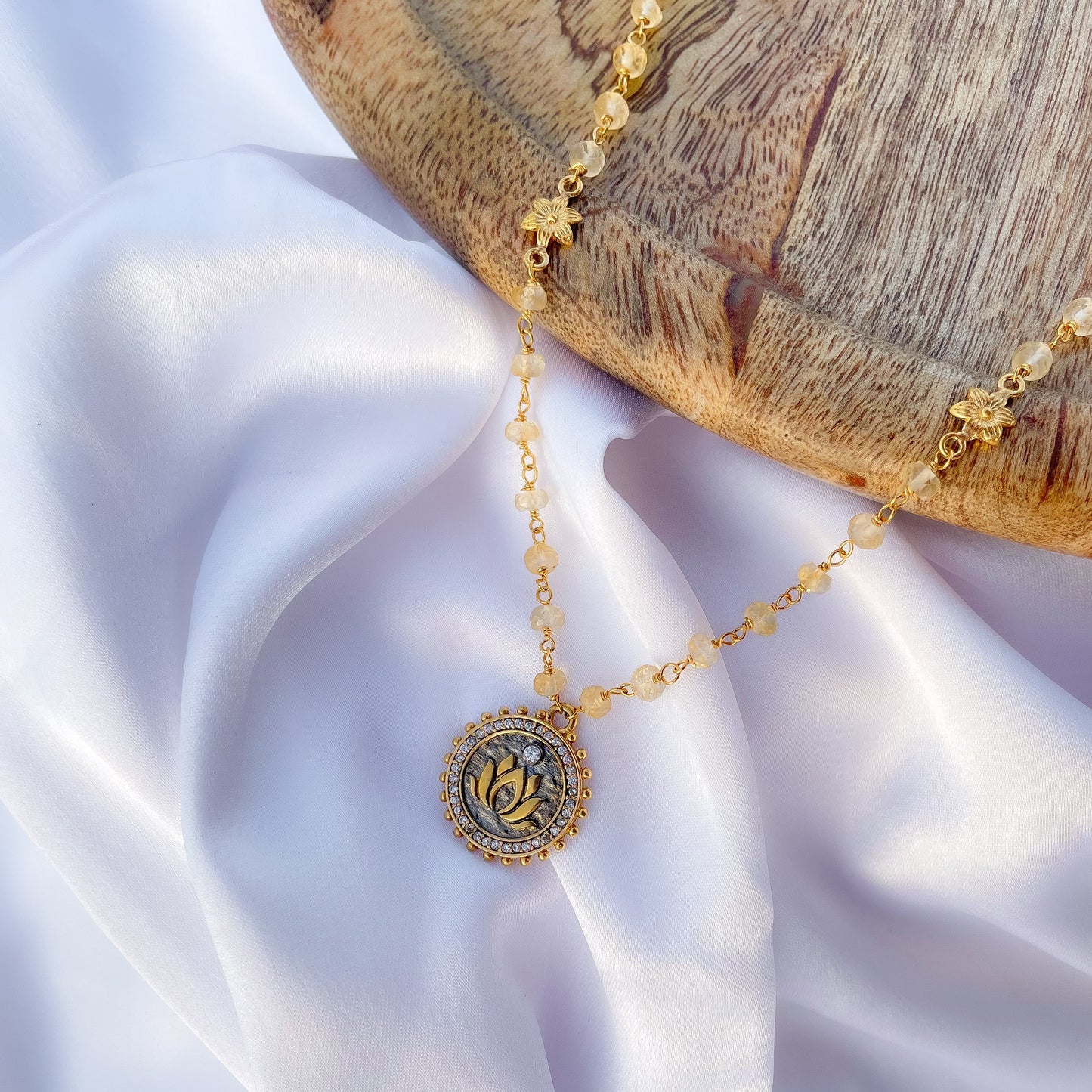 Citrine beaded necklace with Lotus charm and zircon stones in two tone black rhodium and 22k gold plated 925 sterling silver