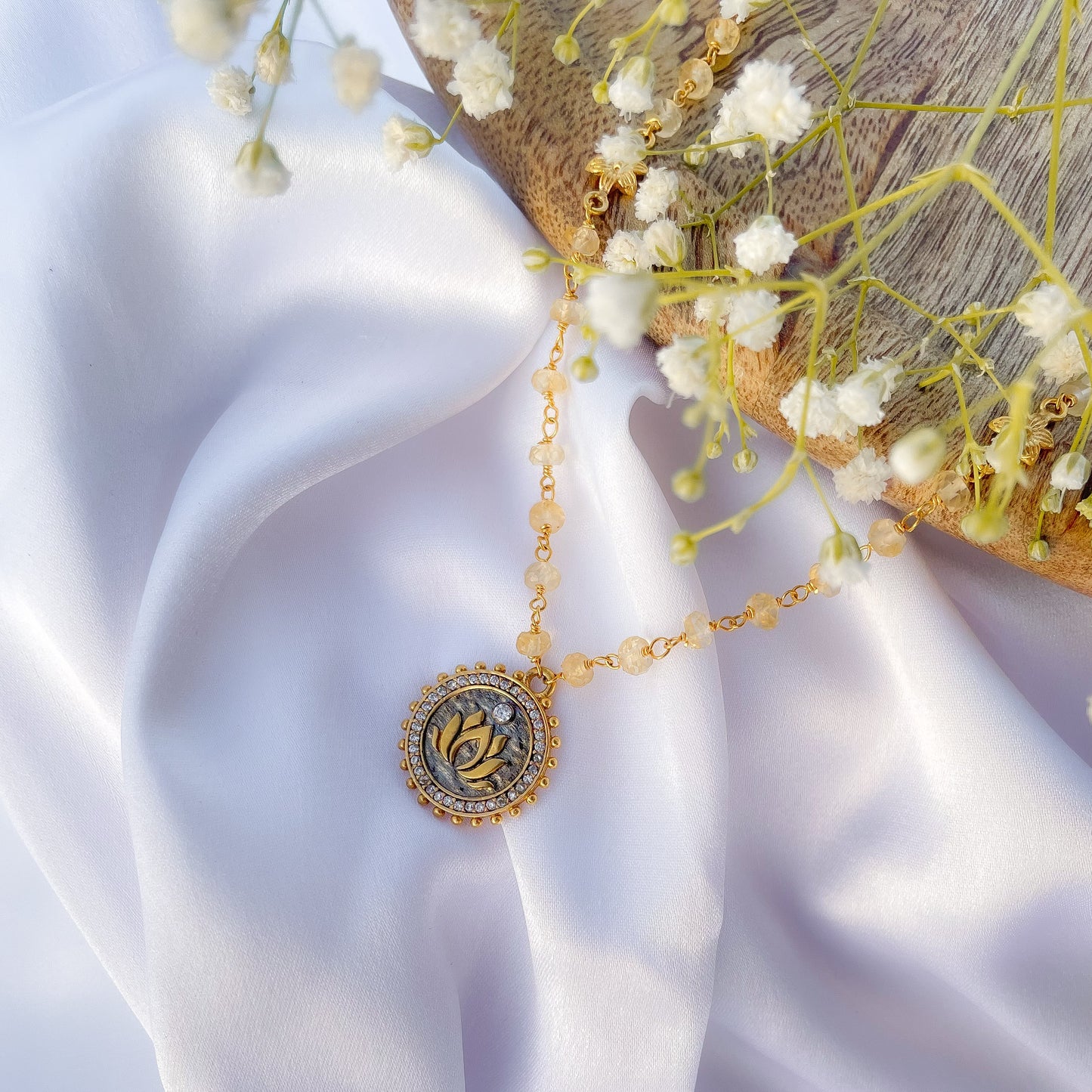 Citrine beaded necklace with Lotus charm and zircon stones in two tone black rhodium and 22k gold plated 925 sterling silver