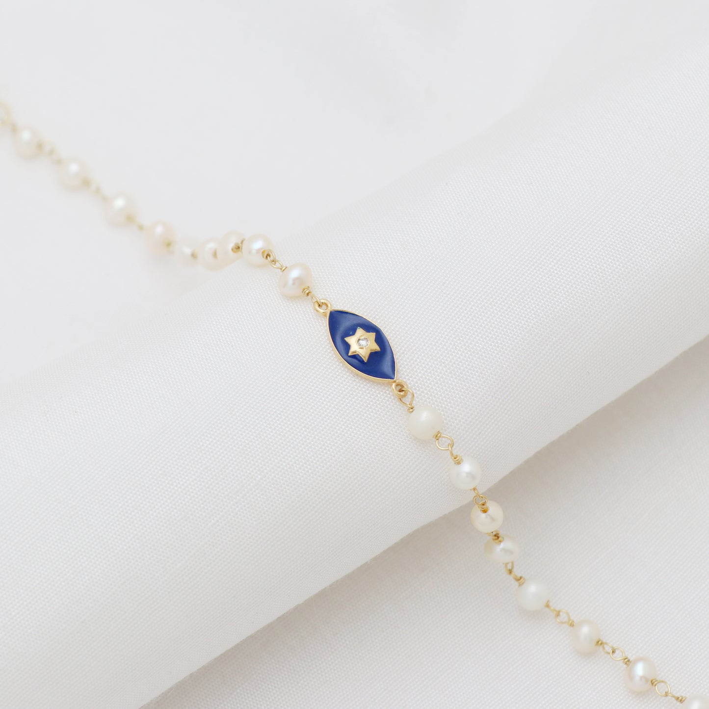 Pearl star charm rosary bracelet with blue enamel and zircon stone in gold plated 925 sterling silver