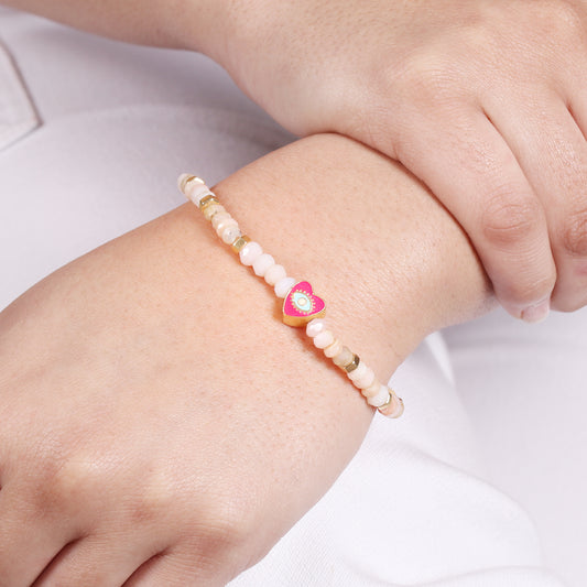 Pink opal heart with evil eye charm stretch bracelet with pink, blue and white enamel in gold plated 925 sterling silver