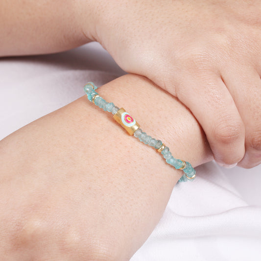 Apatite evil eye charm stretch bracelet with pink and blue enamel in gold plated 925 sterling silver