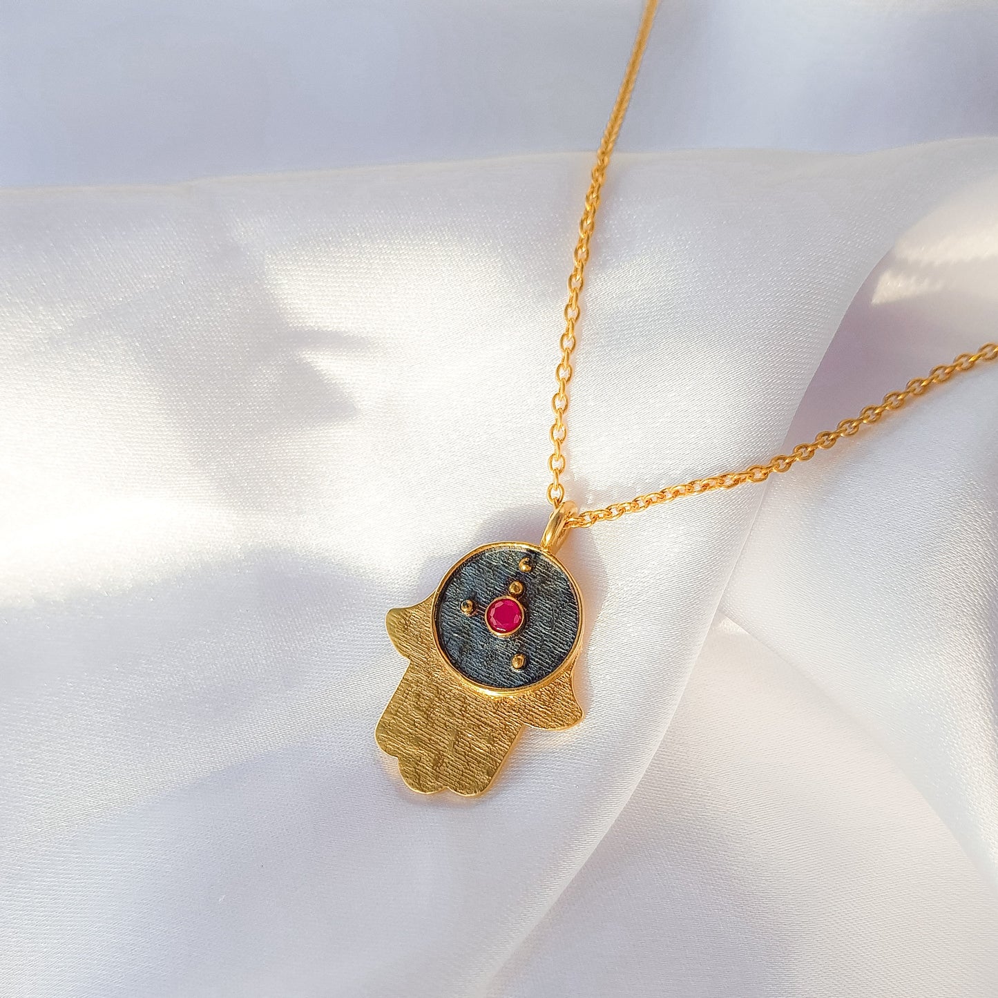 Cancer Zodiac Constellation chain necklace with Hamsa Charm and ruby birthstone in two tone black rhodium and 22k gold plated 925 sterling silver