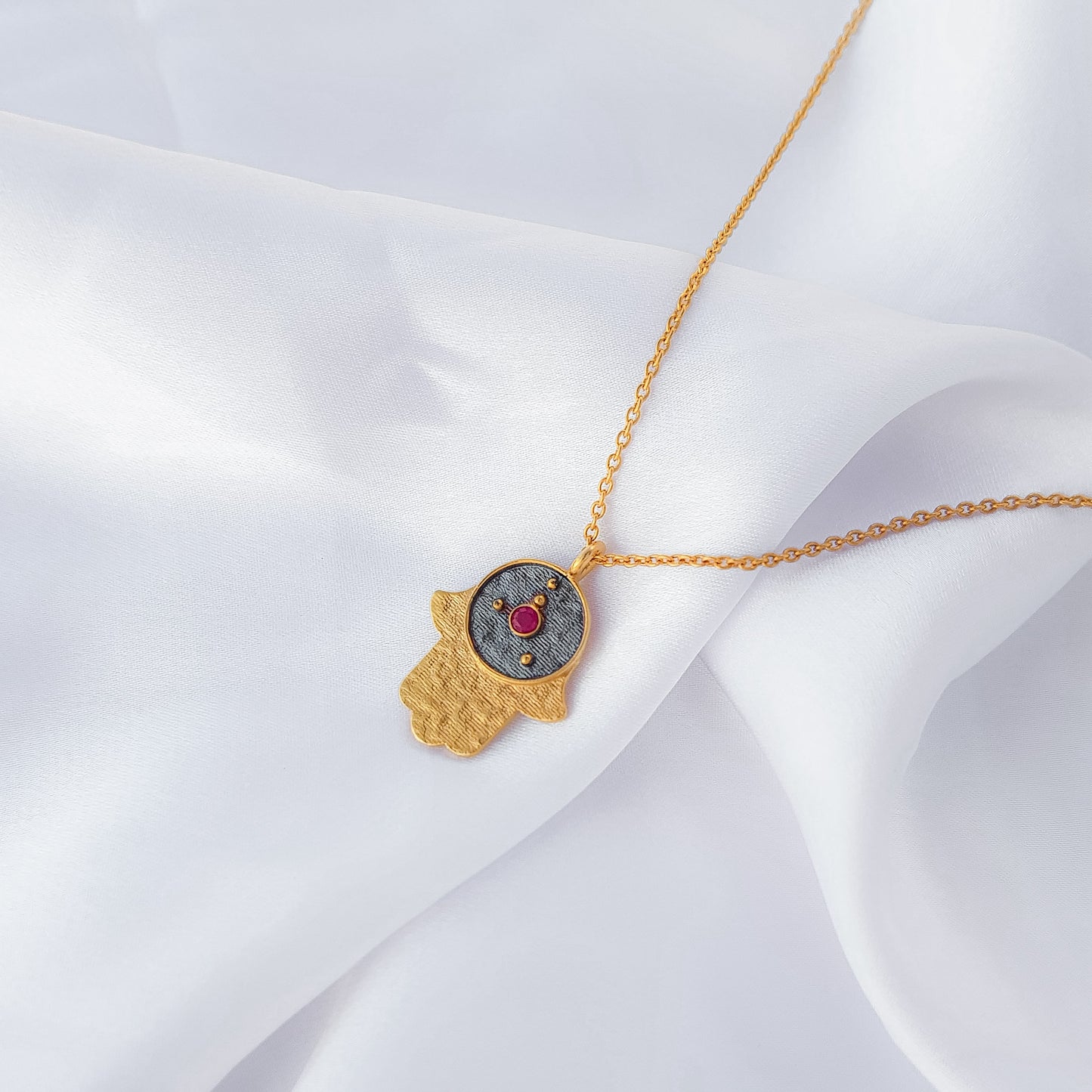 Cancer Zodiac Constellation chain necklace with Hamsa Charm and ruby birthstone in two tone black rhodium and 22k gold plated 925 sterling silver