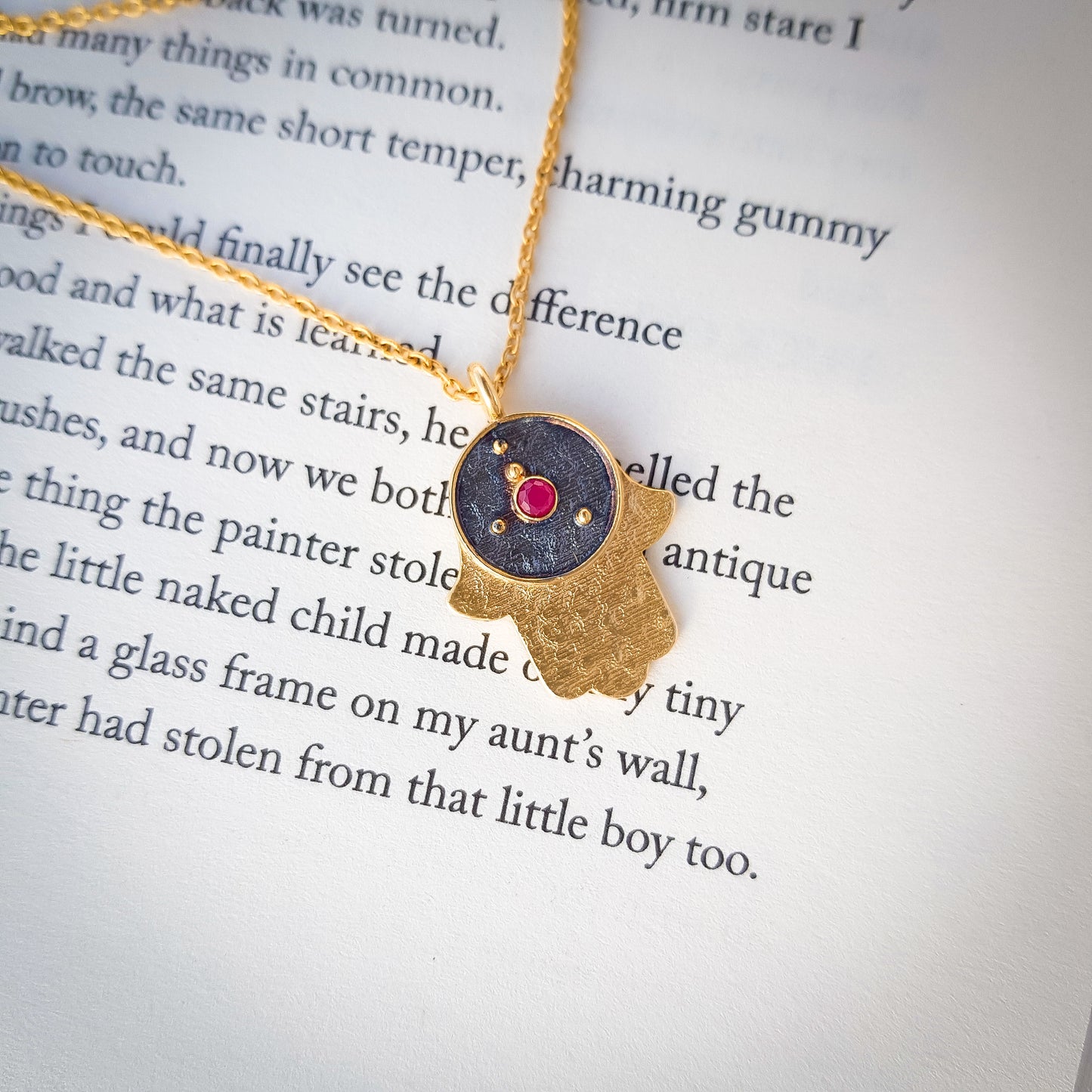 Cancer Zodiac Constellation chain necklace with Hamsa Charm and ruby birthstone in two tone black rhodium and 22k gold plated 925 sterling silver