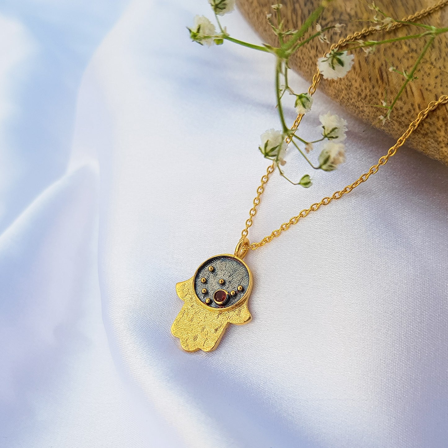 Capricorn Zodiac Constellation chain necklace with Hamsa Charm and Garnet birthstone in two tone black rhodium and 22k gold plated 925 sterling silver