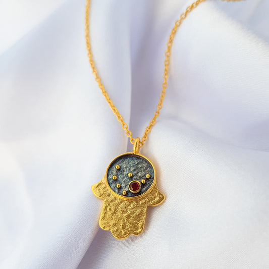Capricorn Zodiac Constellation chain necklace with Hamsa Charm and Garnet birthstone in two tone black rhodium and 22k gold plated 925 sterling silver