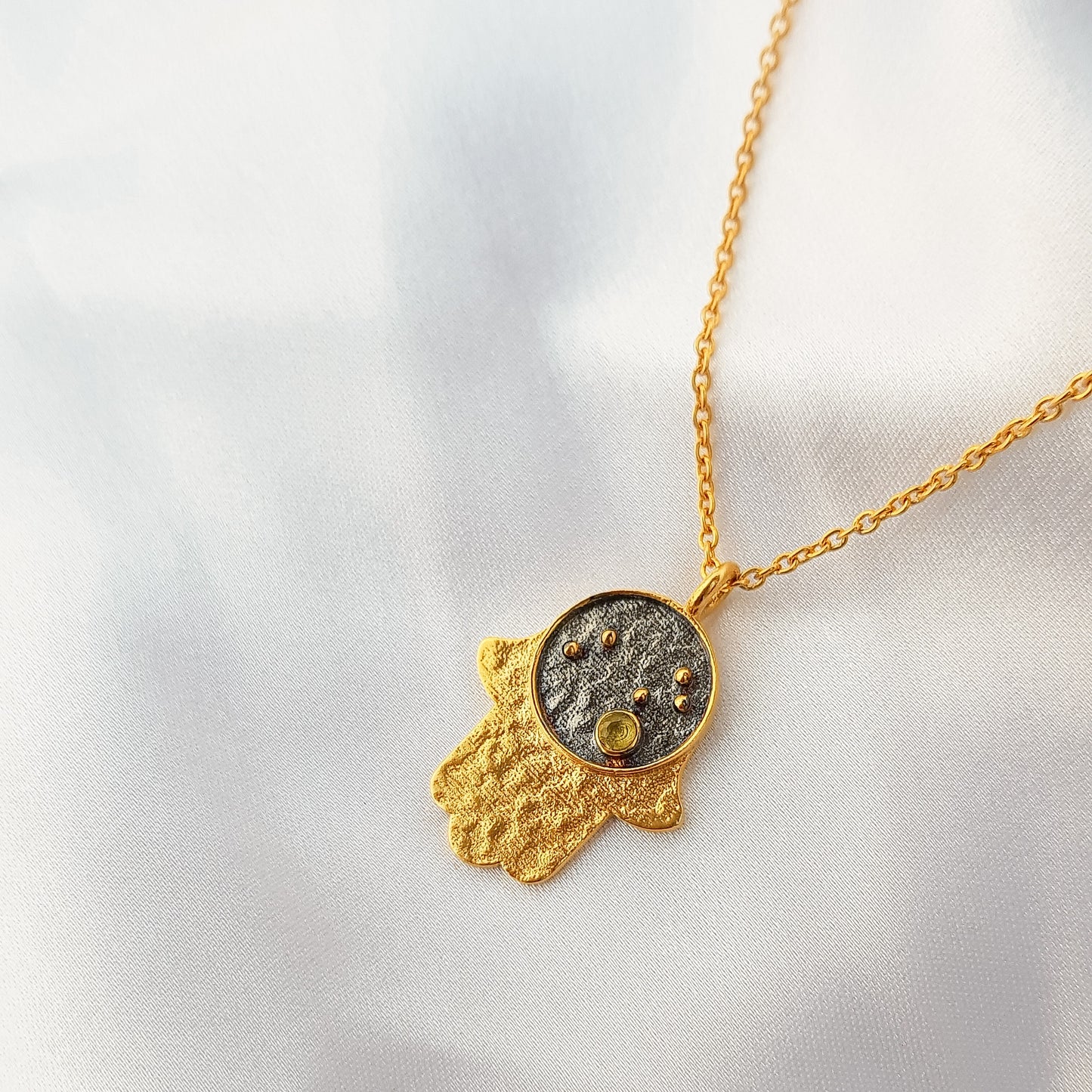Leo Zodiac Constellation chain necklace with Hamsa Charm and Peridot birthstone in two tone black rhodium and 22k gold plated 925 sterling silver