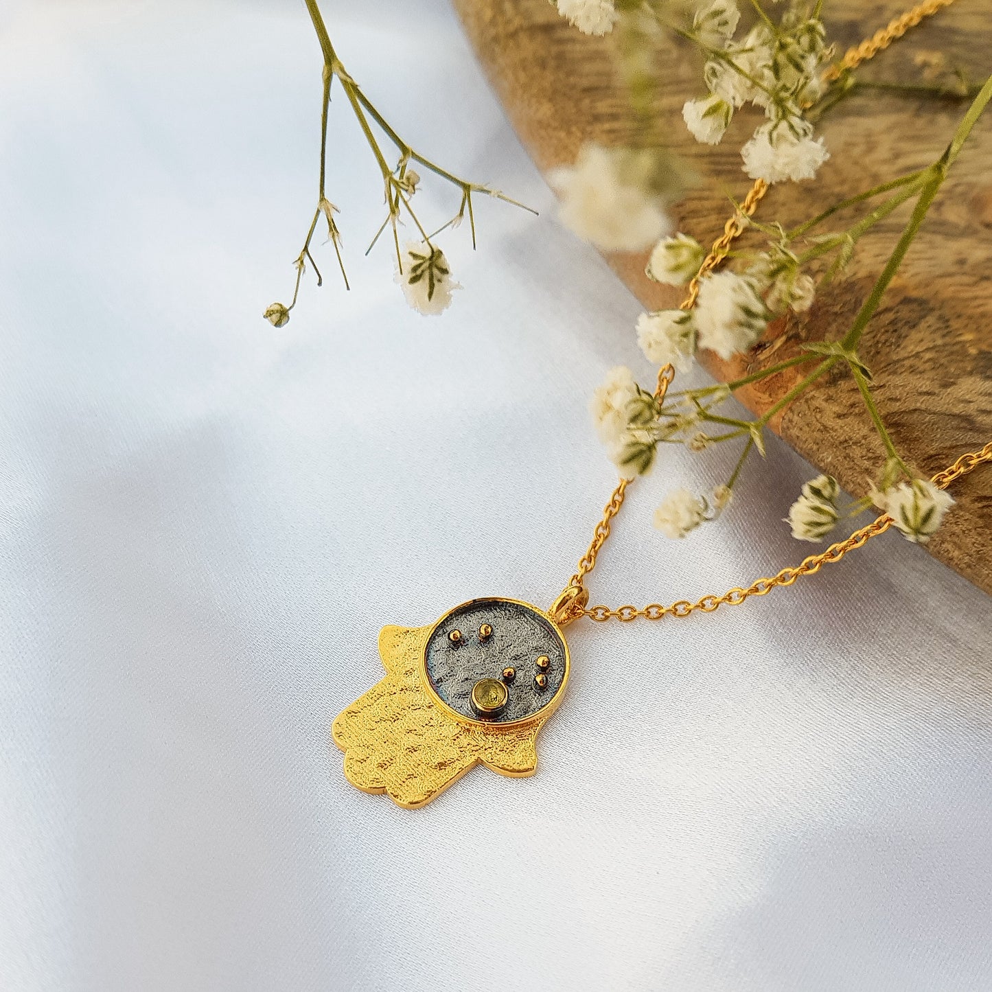 Leo Zodiac Constellation chain necklace with Hamsa Charm and Peridot birthstone in two tone black rhodium and 22k gold plated 925 sterling silver