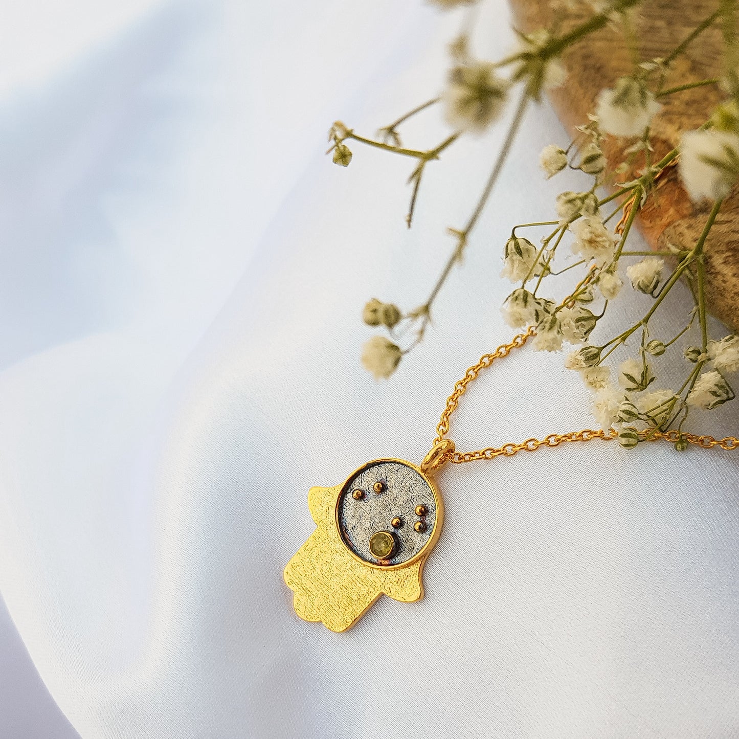 Leo Zodiac Constellation chain necklace with Hamsa Charm and Peridot birthstone in two tone black rhodium and 22k gold plated 925 sterling silver