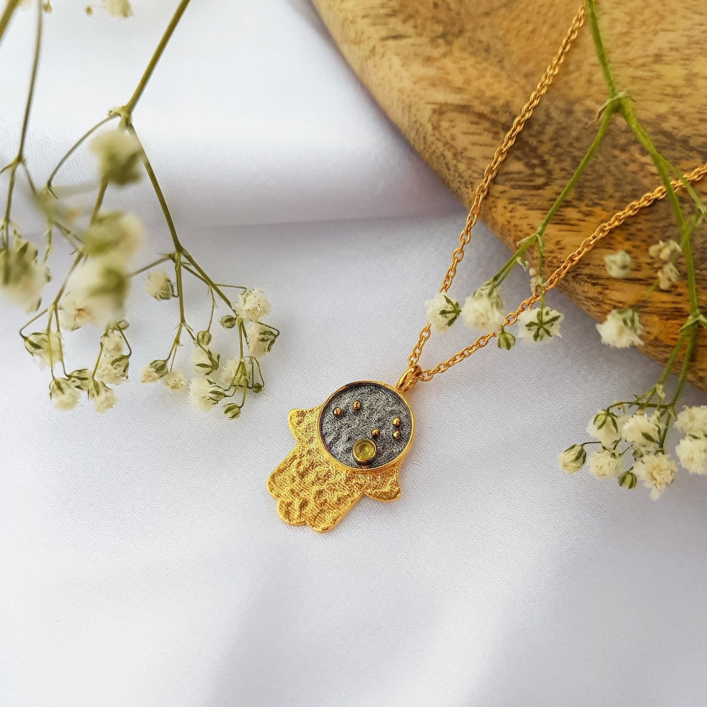 Leo Zodiac Constellation chain necklace with Hamsa Charm and Peridot birthstone in two tone black rhodium and 22k gold plated 925 sterling silver