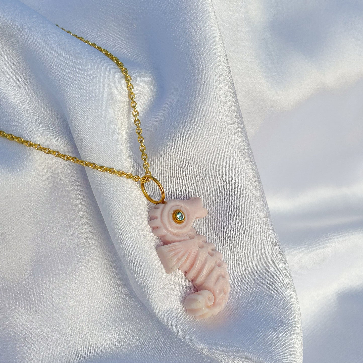 Sea Horse hand-carved pendant in Pink Opal with Blue Topaz gemstone in gold plated Brass chain necklace