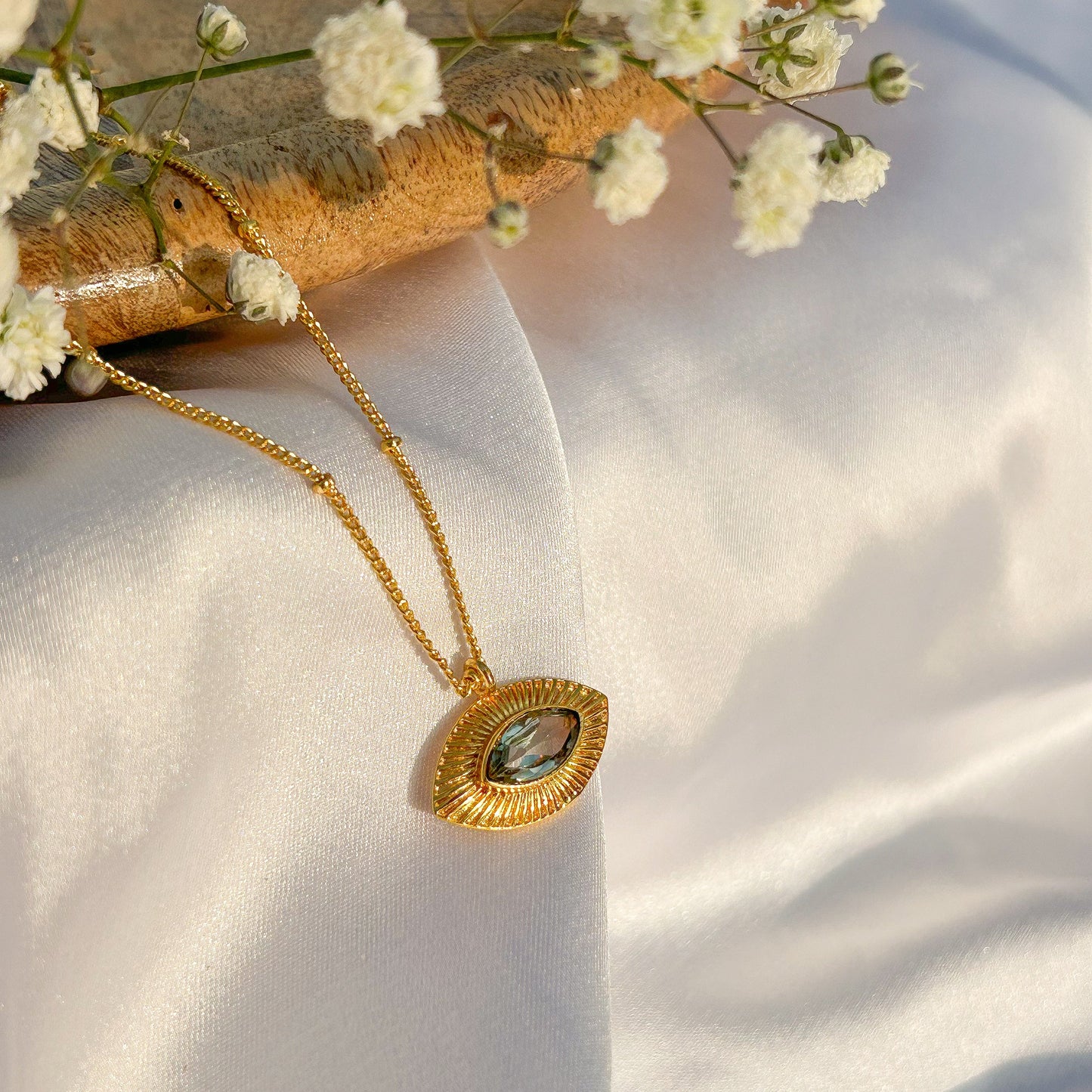 Evil Eye ball chain necklace with Blue Topaz gemstones in gold plated Brass