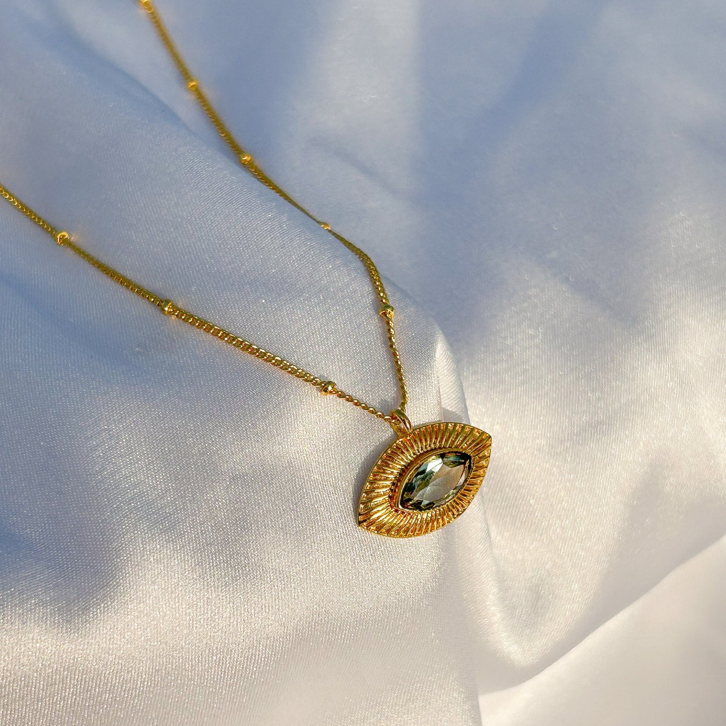 Evil Eye ball chain necklace with Blue Topaz gemstones in gold plated Brass