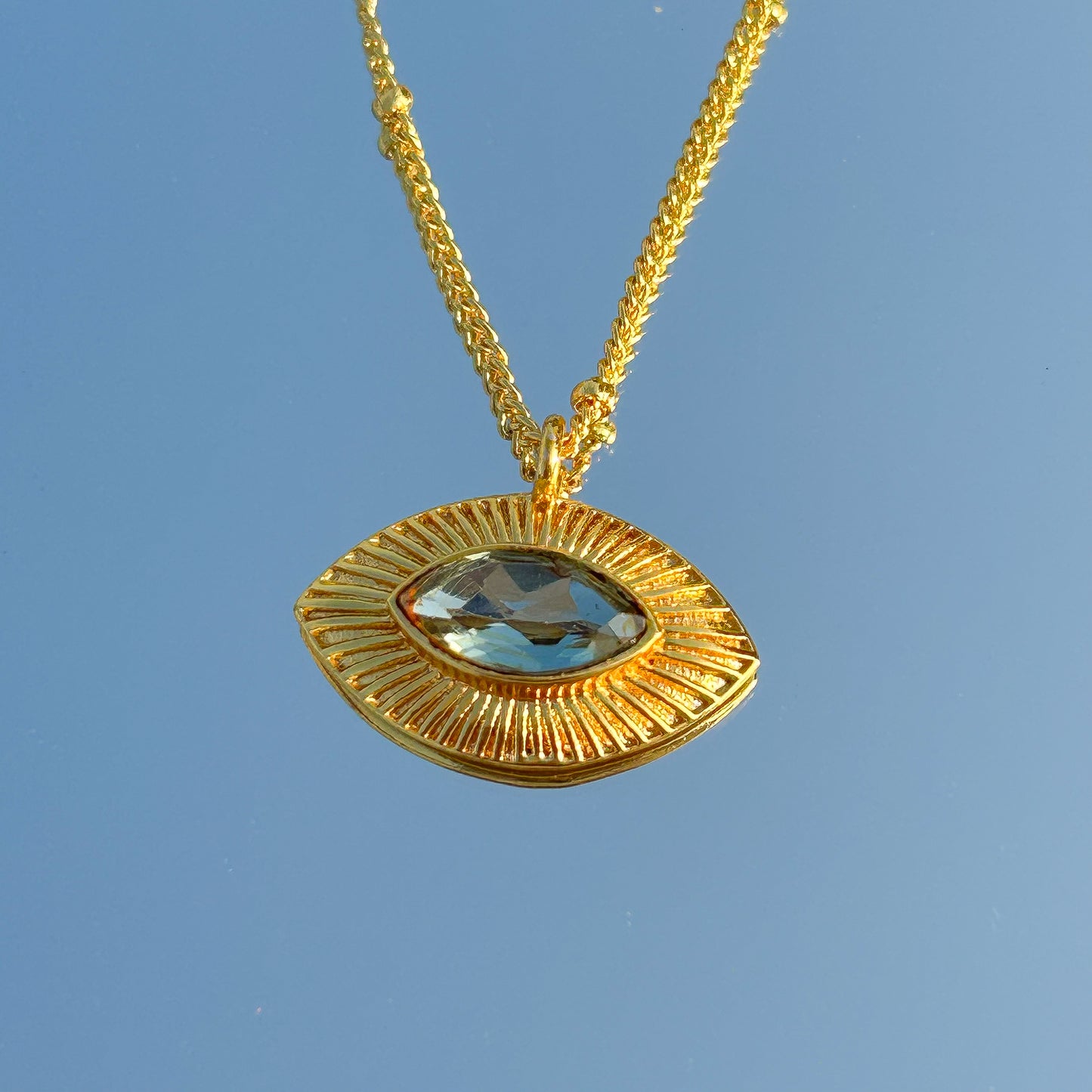Evil Eye ball chain necklace with Blue Topaz gemstones in gold plated Brass