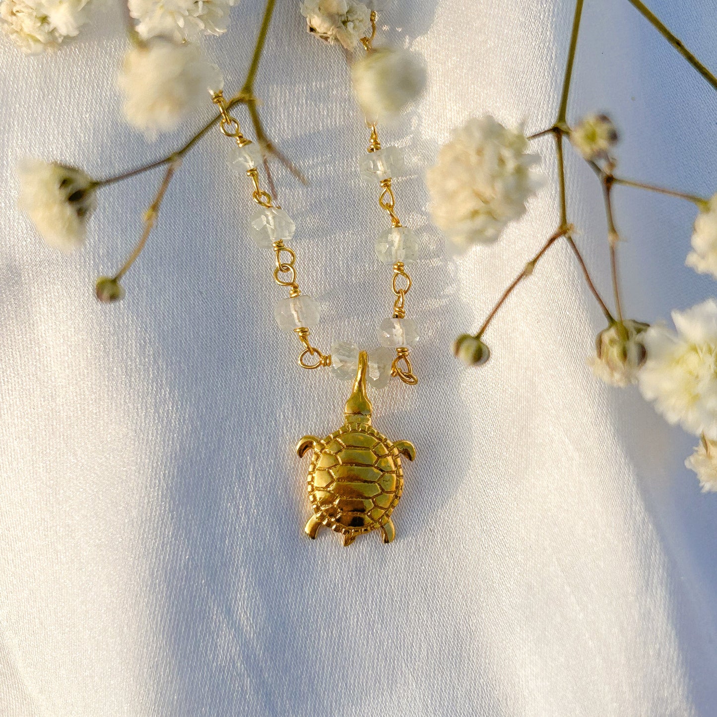 Aquamarine beaded necklace with Turtle charm in gold plated Brass
