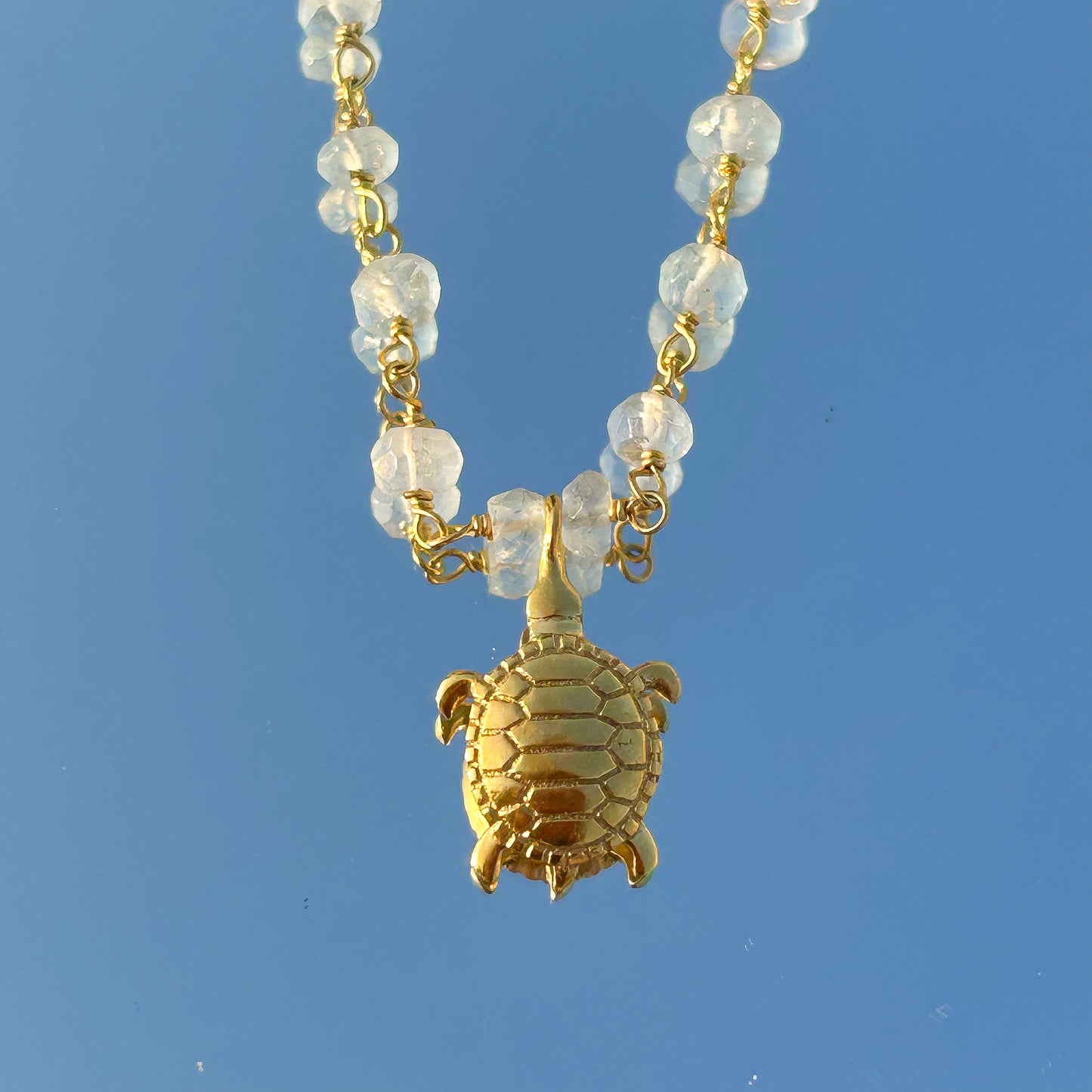 Aquamarine beaded necklace with Turtle charm in gold plated Brass