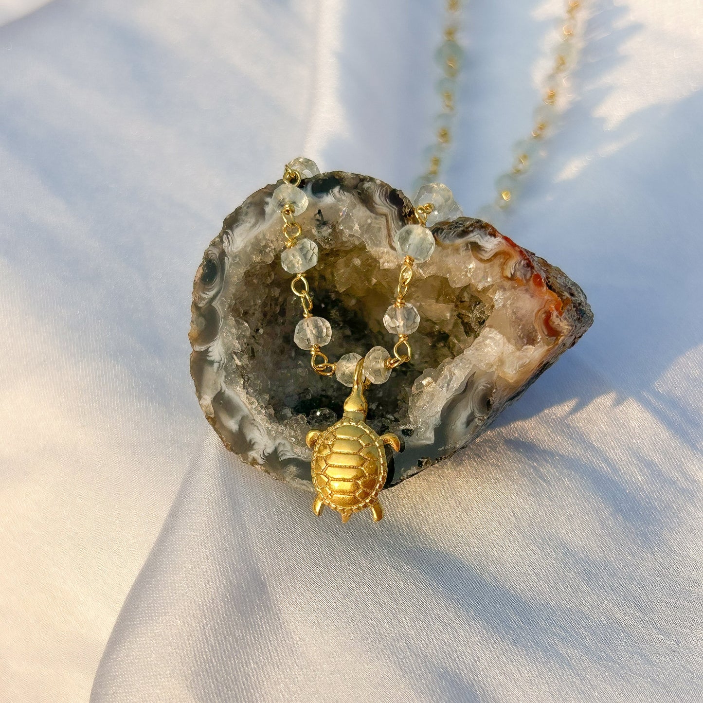 Aquamarine beaded necklace with Turtle charm in gold plated Brass