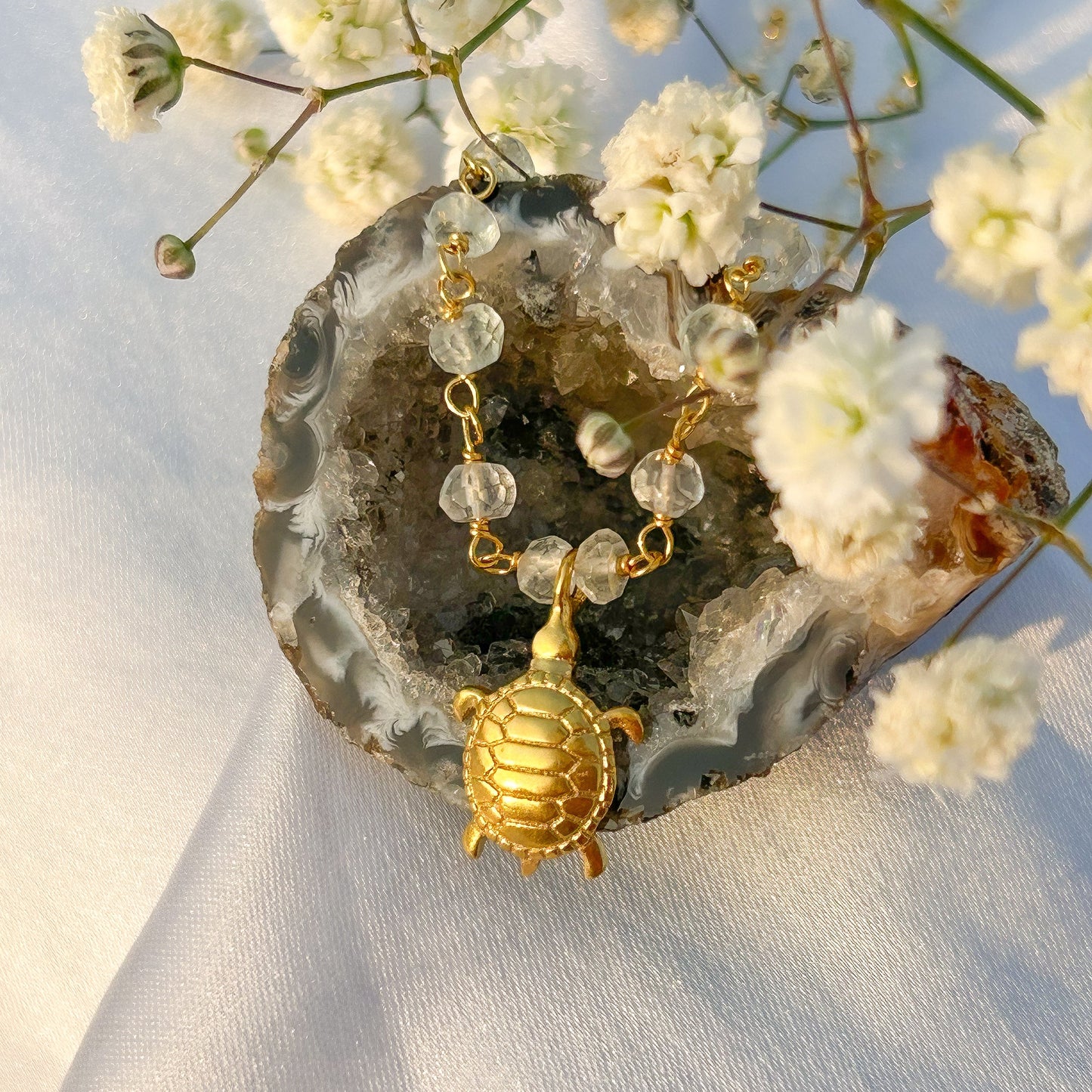 Aquamarine beaded necklace with Turtle charm in gold plated Brass