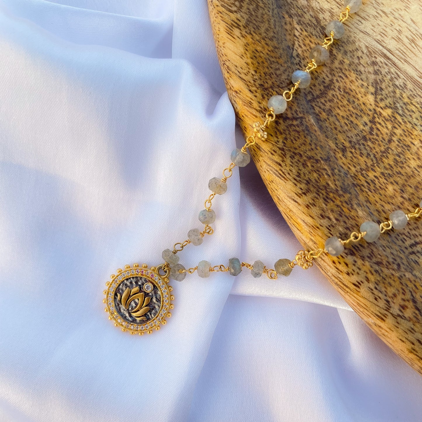 Labradorite beaded necklace with Lotus charm and zircon stones in two tone black rhodium and 22k gold plated 925 sterling silver