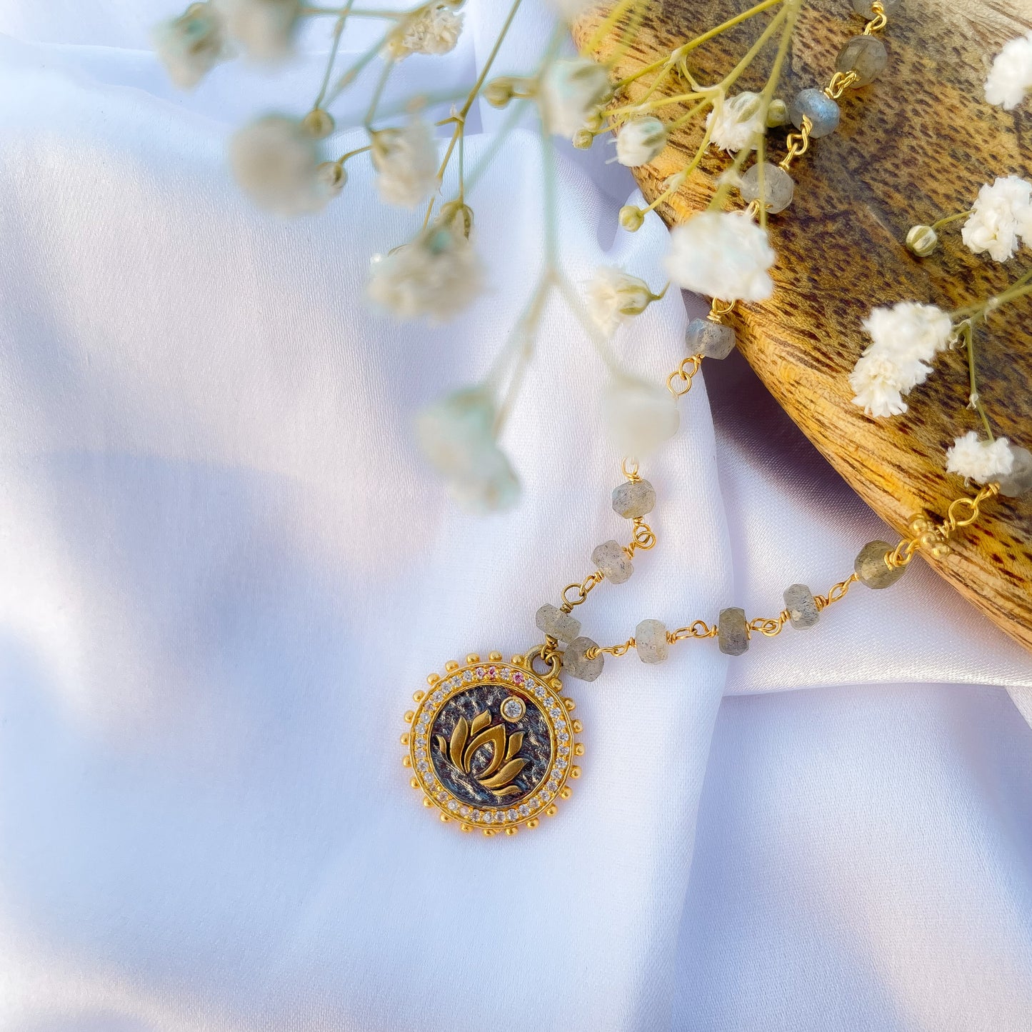 Labradorite beaded necklace with Lotus charm and zircon stones in two tone black rhodium and 22k gold plated 925 sterling silver