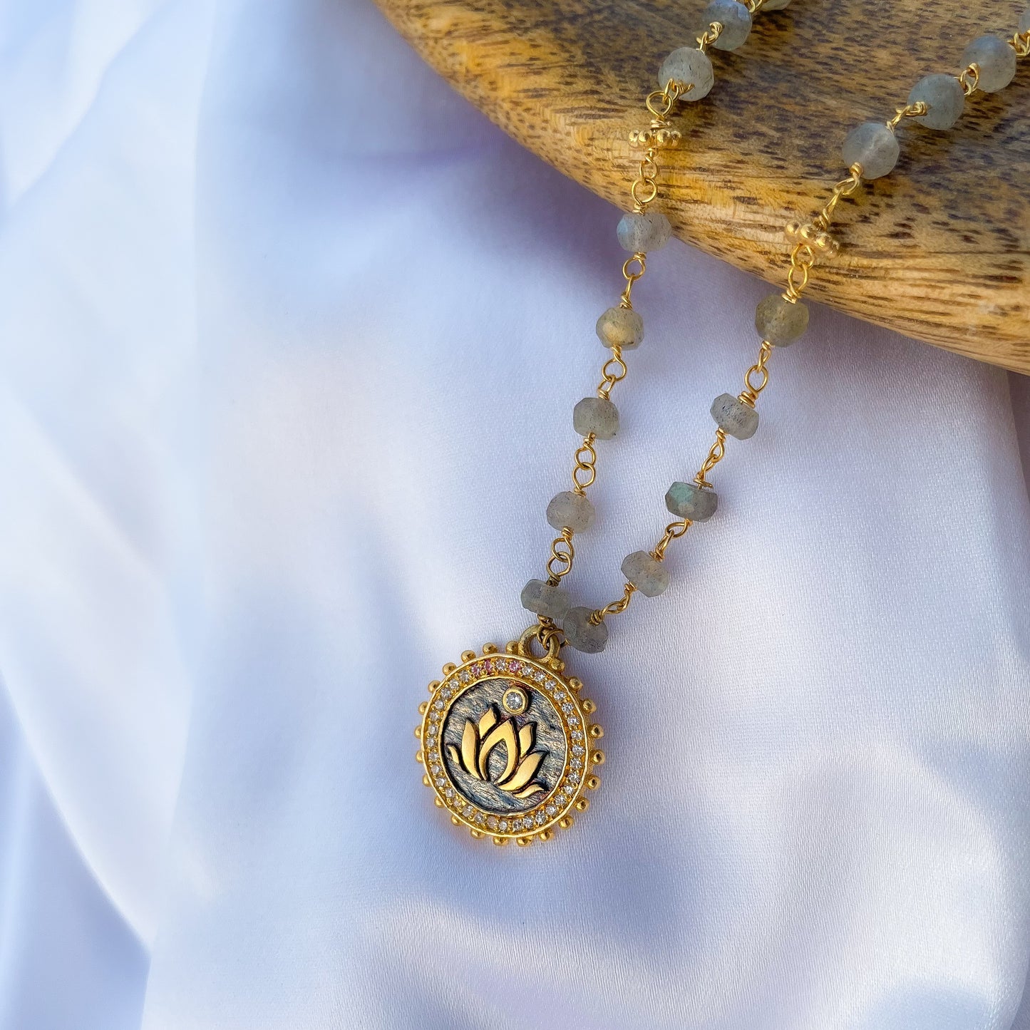 Labradorite beaded necklace with Lotus charm and zircon stones in two tone black rhodium and 22k gold plated 925 sterling silver