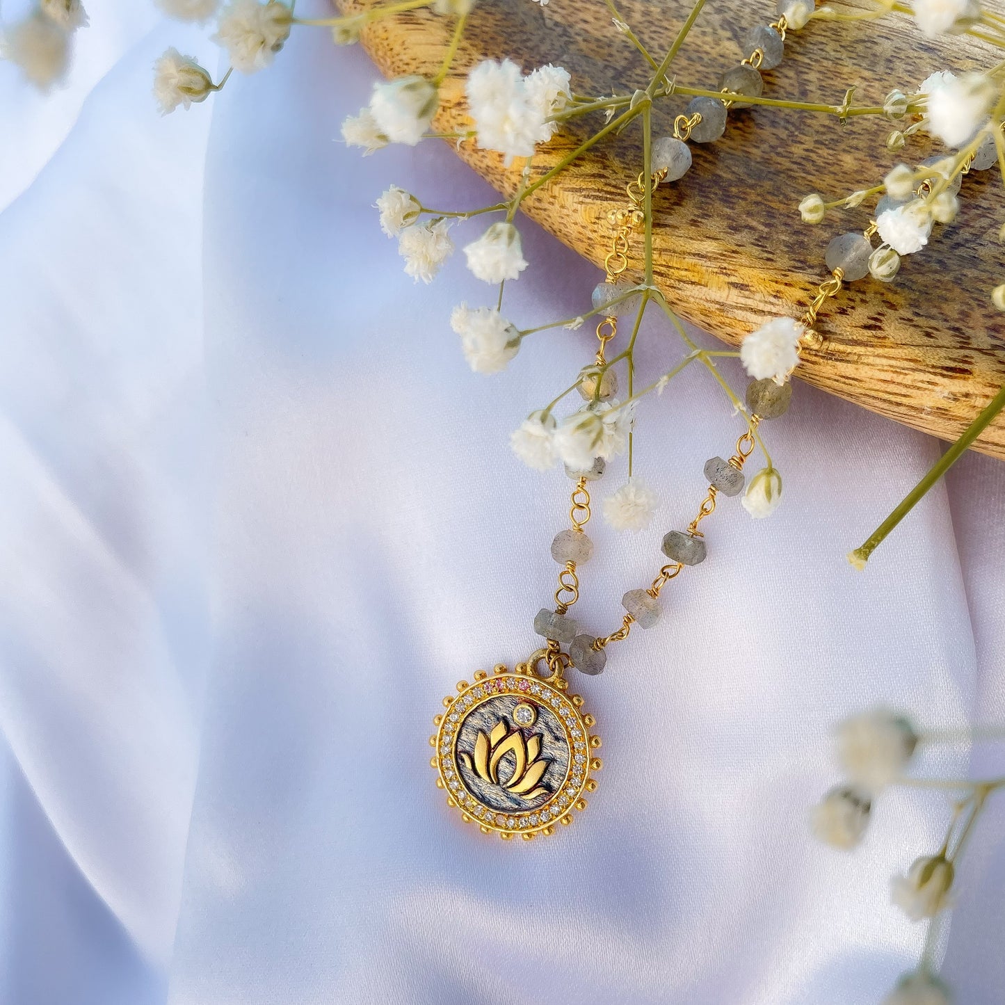 Labradorite beaded necklace with Lotus charm and zircon stones in two tone black rhodium and 22k gold plated 925 sterling silver