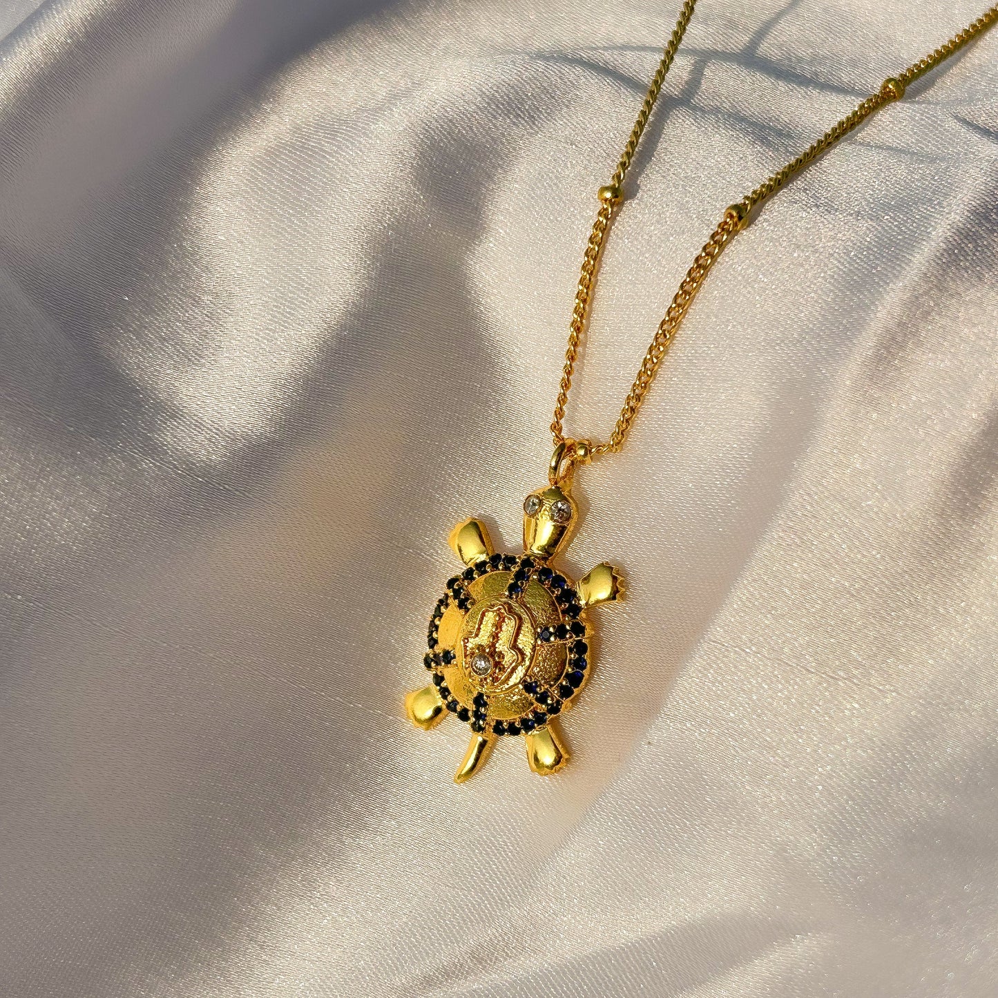 Hamsa Turtle charm ball chain necklace with green, blue and white zircon gemstones in gold plated Brass